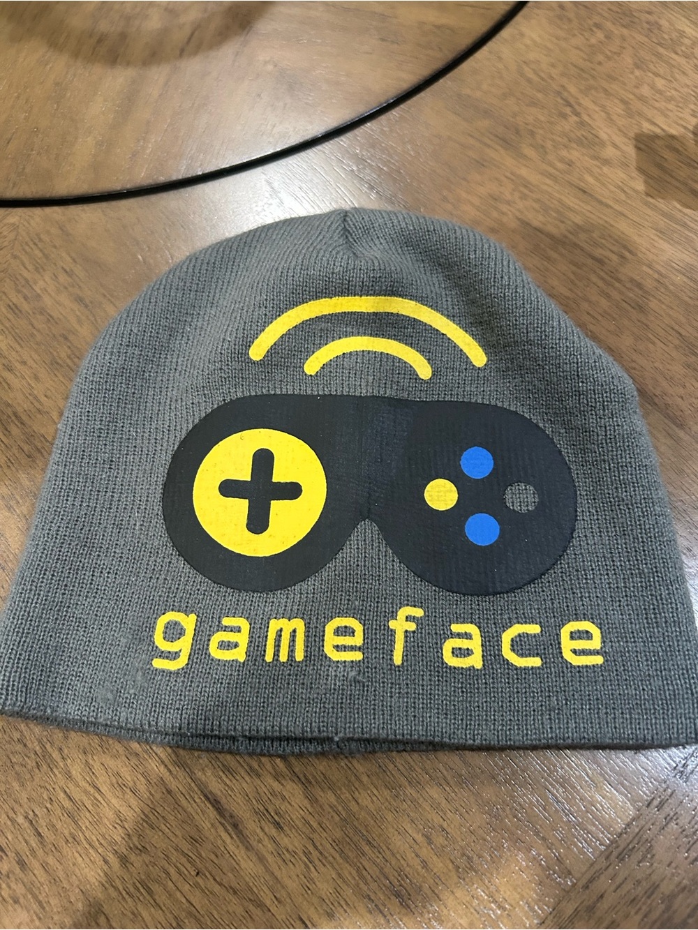 Gameface Gray Knit Beanie with Yellow & Blue Graphic, 9 x 8 with stretch.
